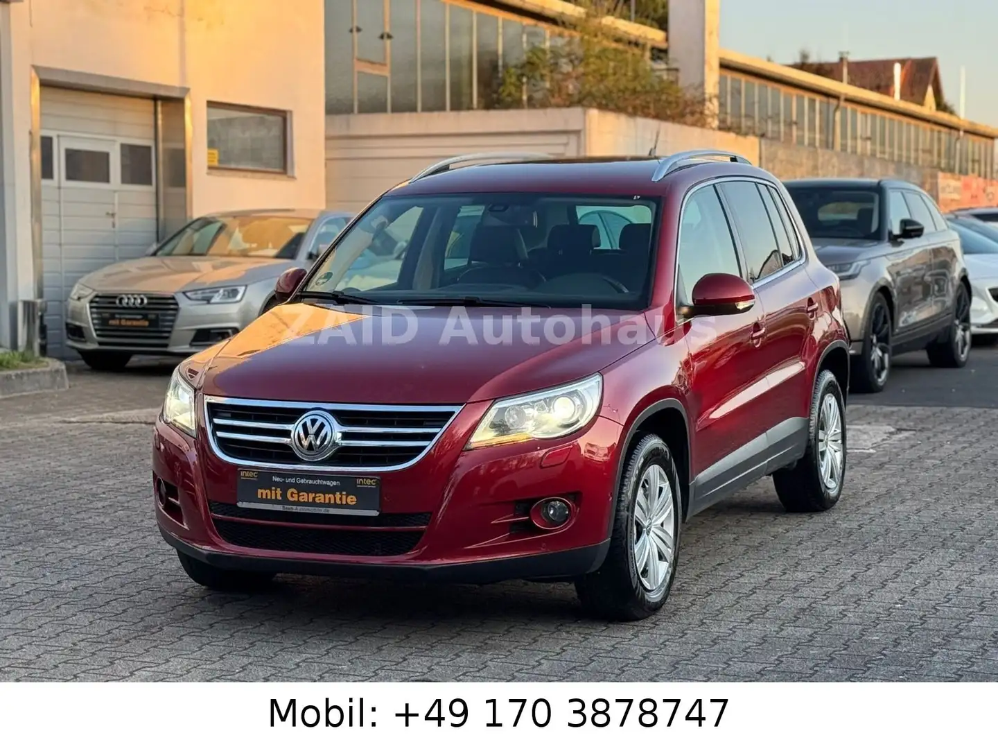 Volkswagen Tiguan Sport & Style 4Motion*Aut*NAVI*PDC*AHK*XE Rot - 1