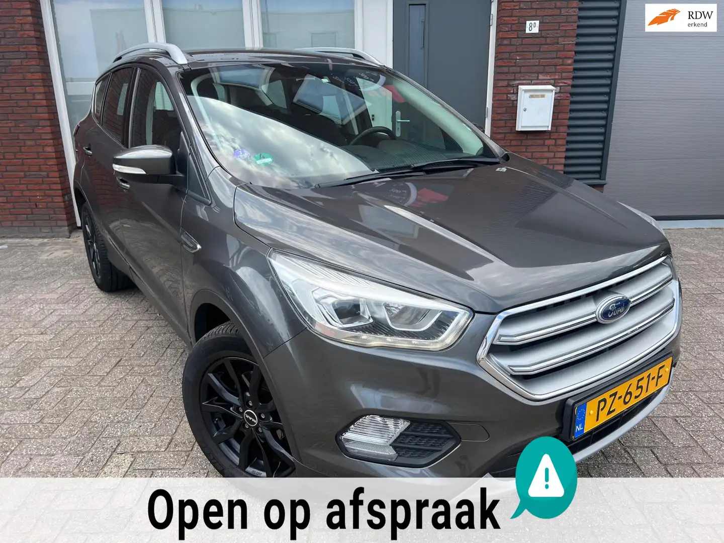 Ford Kuga 1.5 EcoBoost Trend Ultimate / Navi / PDC / Clima Grijs - 1