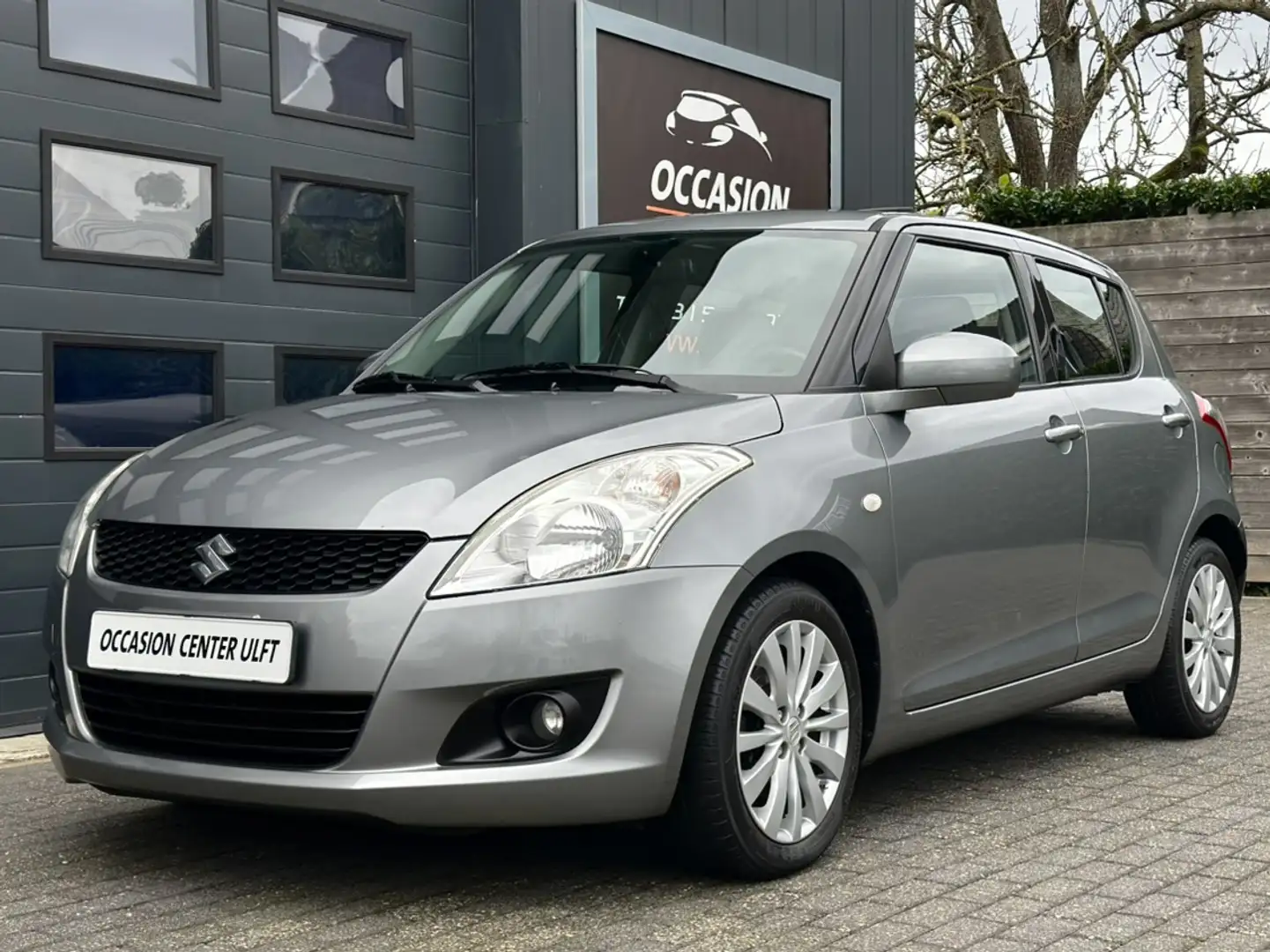 Suzuki Swift CLIMATE CRUISE CONTR / EL DAK / NAVIGATIE ... Gris - 1