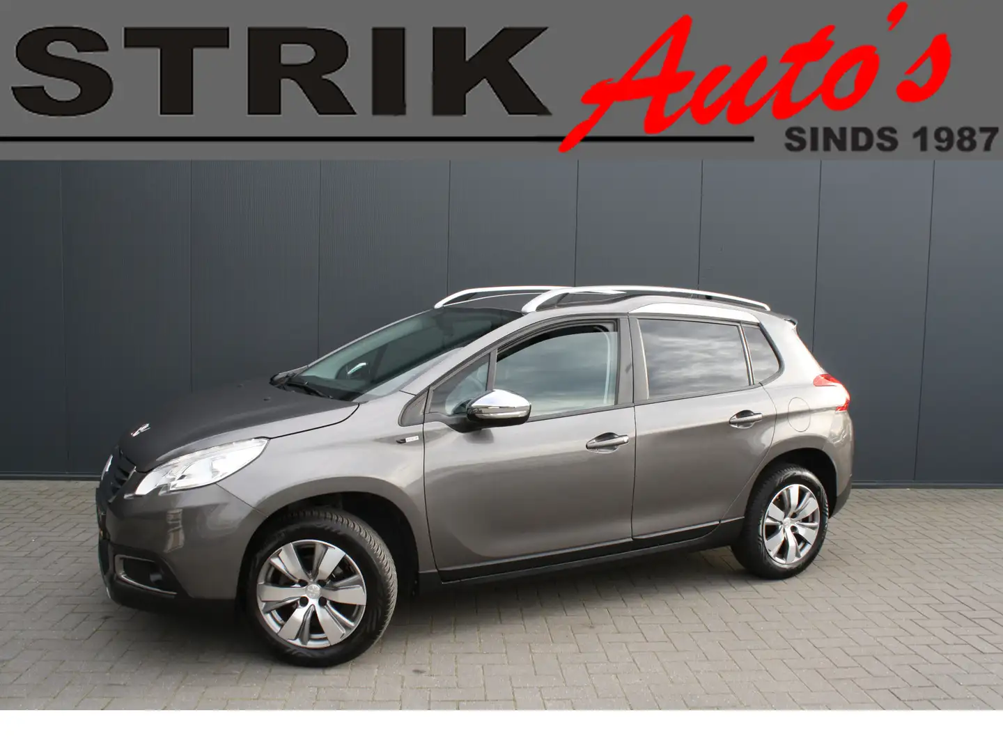 Peugeot 2008 1.2 PureTech Style - RIJKLAAR - NAVIGATIE - CLIMAT Grijs - 1