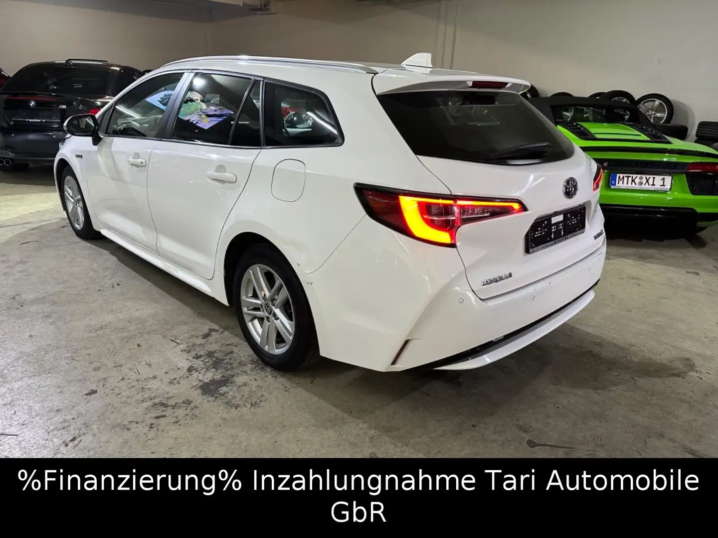 Toyota Corolla Touring Sports Hybrid Business Edition Wit - 1