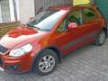 Suzuki SX4 1,6 GLX Navigator Oranje - thumbnail 1