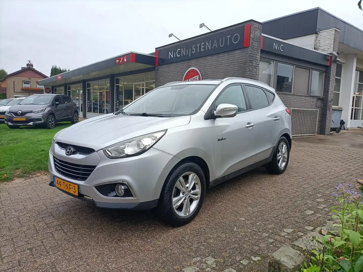Hyundai iX35 1.6 GDi Business Ed. Navi,Cruise,Trekhaak afn Grijs - 1