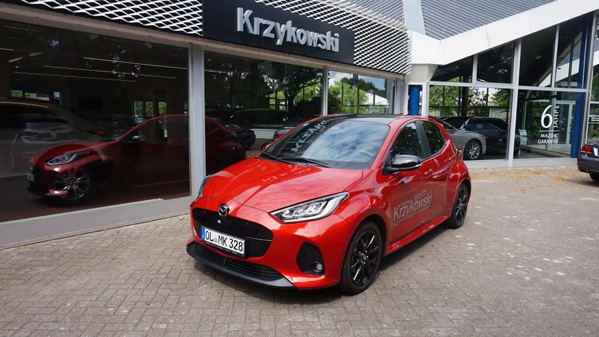 Mazda 2 HYB 1.5L Hybrid VVT-i FWD HOMURA PLUS Rot - 1