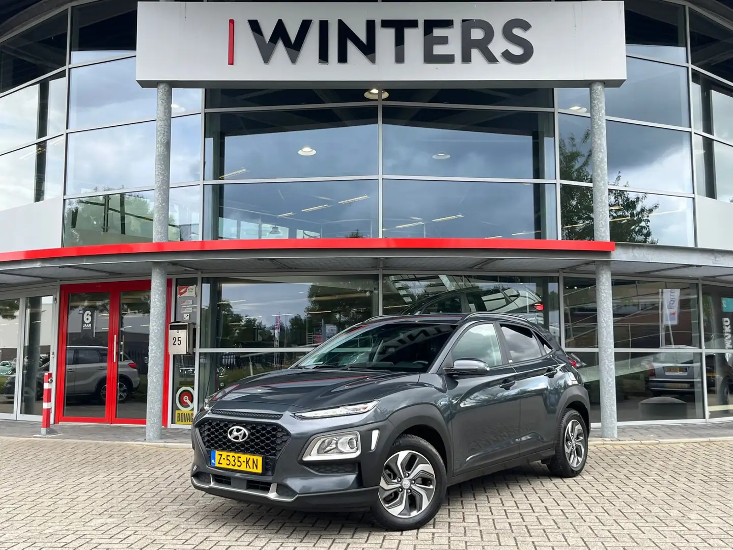 Hyundai KONA 1.6 GDI HEV Comfort | Navigatie | Trekhaak | Camer Gris - 1