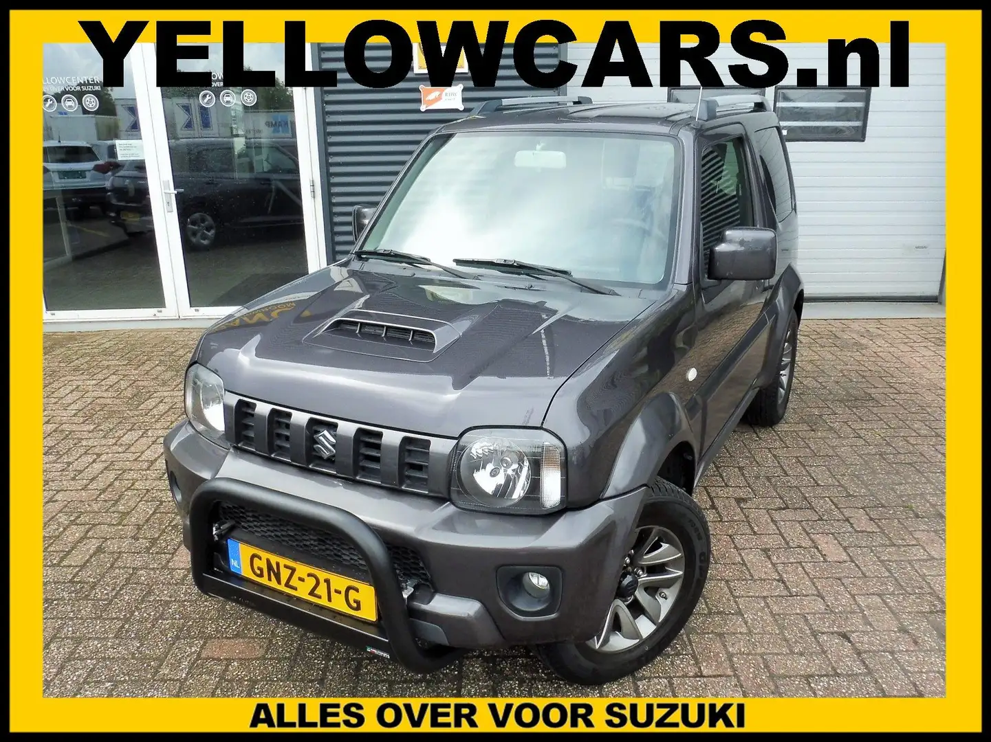 Suzuki Jimny 1.3 Exclusive 4x4 LEDER/NAVI Grijs - 1