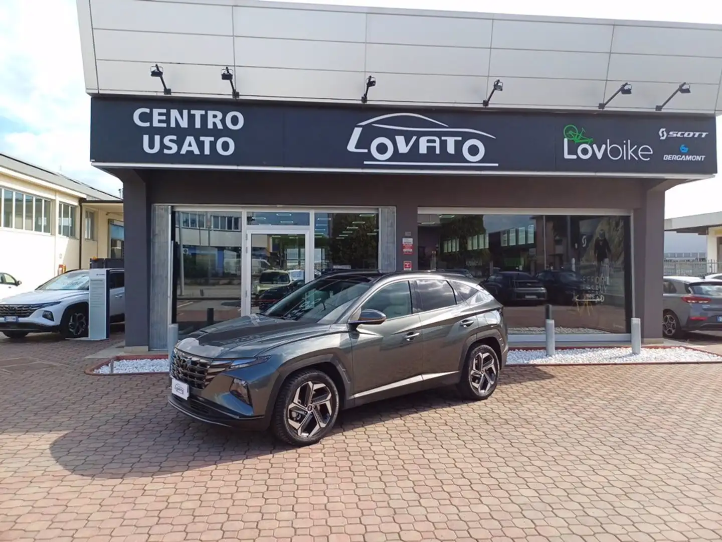 Hyundai TUCSON NEW 1.6HEV AT 230 EX + LO + DP Gris - 1