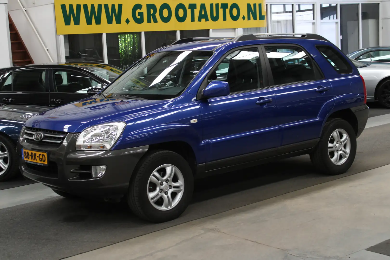 Kia Sportage 2.0 CVVT Comfort NAP, Trekhaak, Airco, Cruise cont Blauw - 1