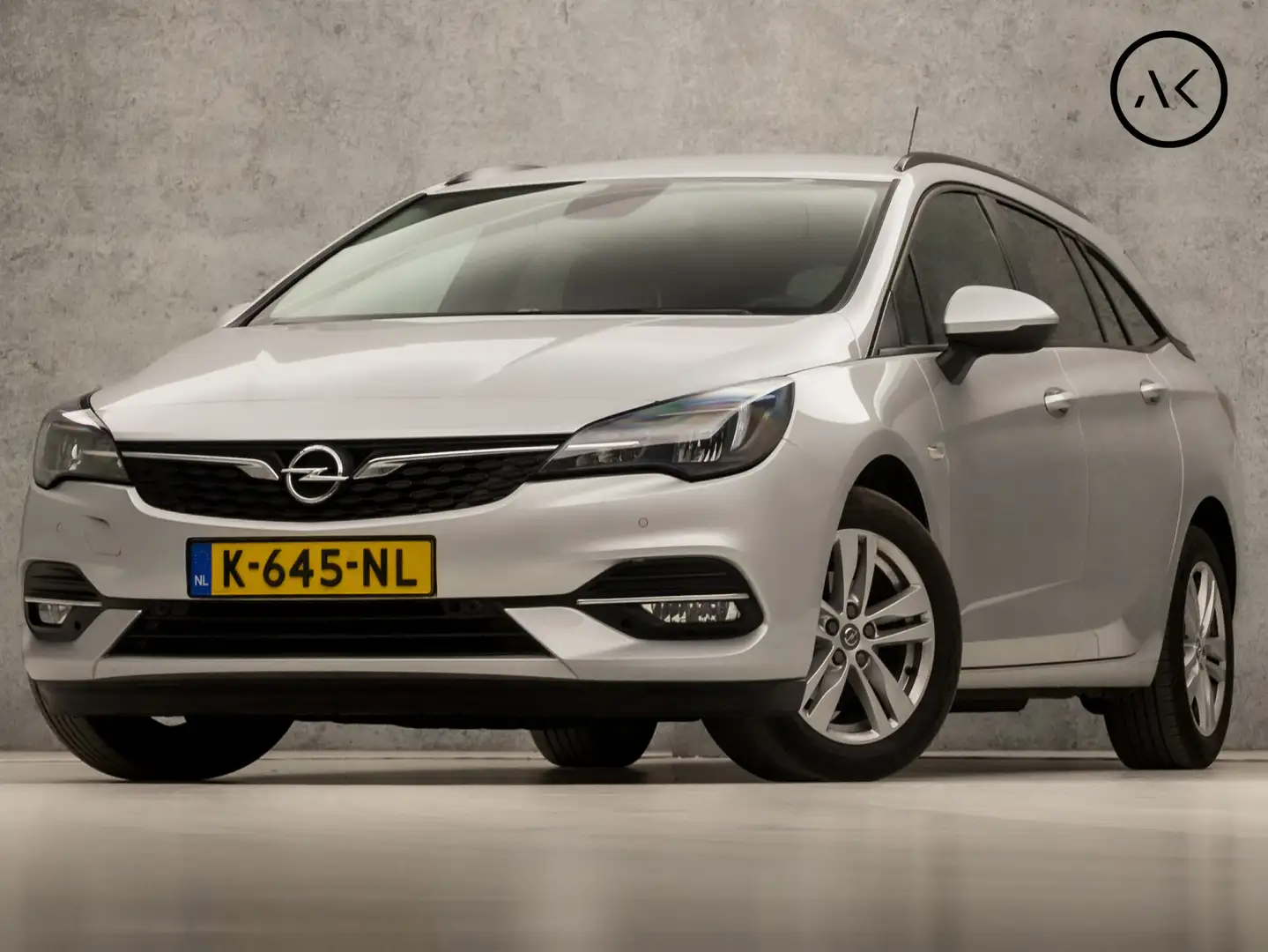 Opel Astra Sports Tourer 1.4 Sport 146Pk Automaat (APPLE CARP Grijs - 1