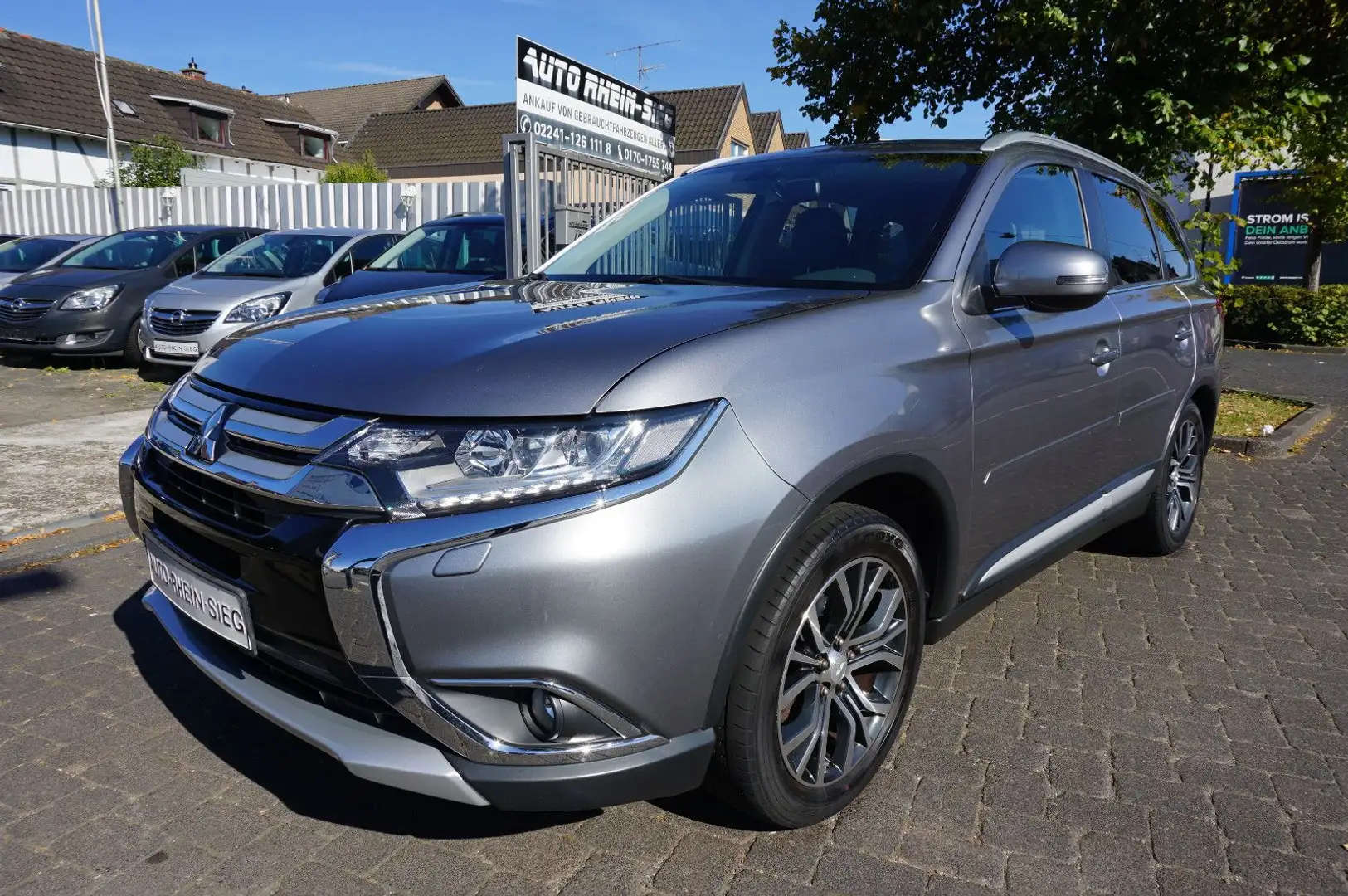 Mitsubishi Outlander Top 4WD 1-Hand/7 Sitze/Leder/Navi !! Grijs - 1