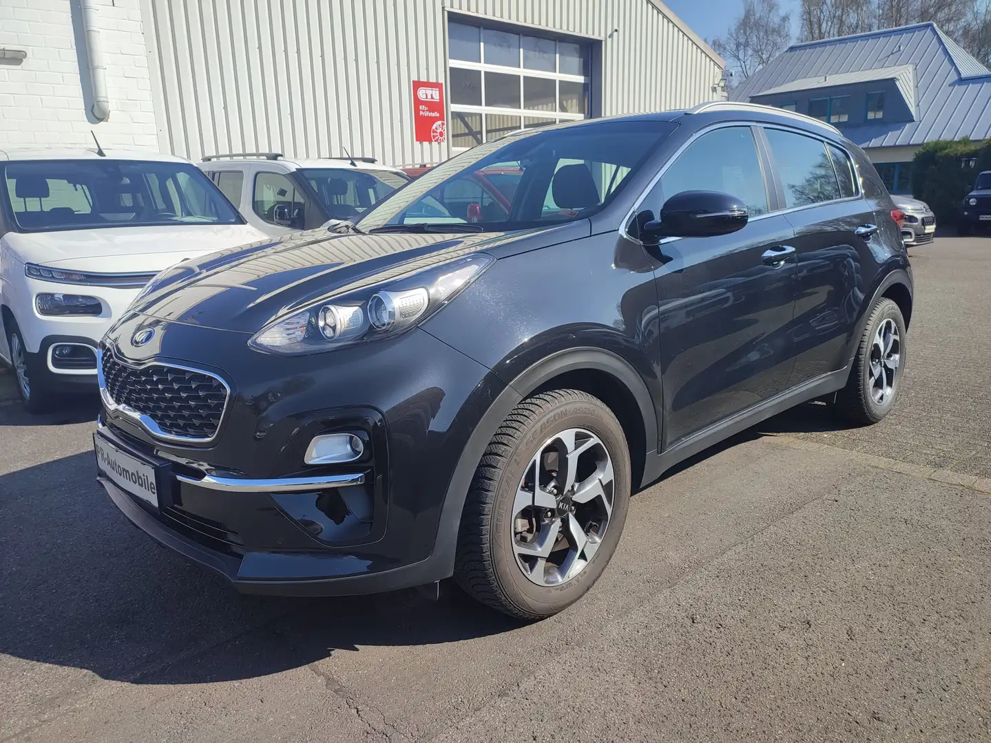 Kia Sportage 1.6 T-GDI DCT Klimaaut/Navi+Cam/AHK/Alu Schwarz - 1