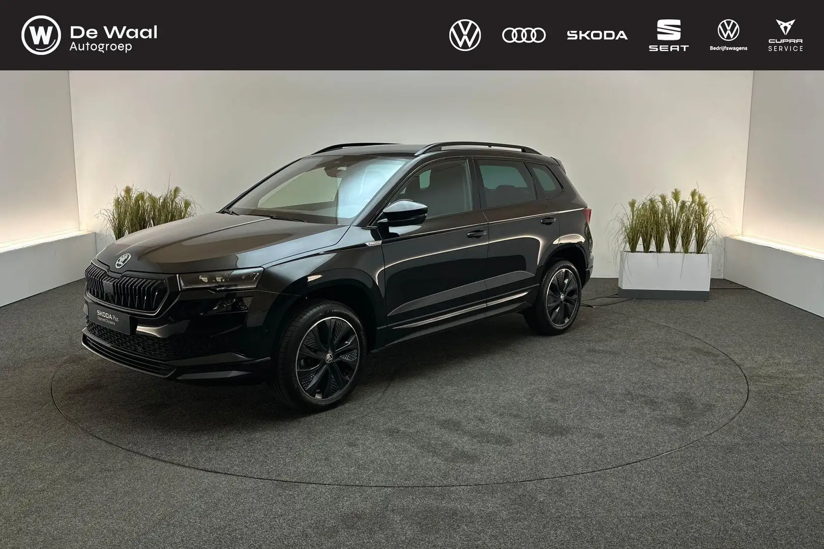 Skoda Karoq 1.5 TSI 150pk DSG ACT Sportline | Park Assist, Tre Zwart - 1