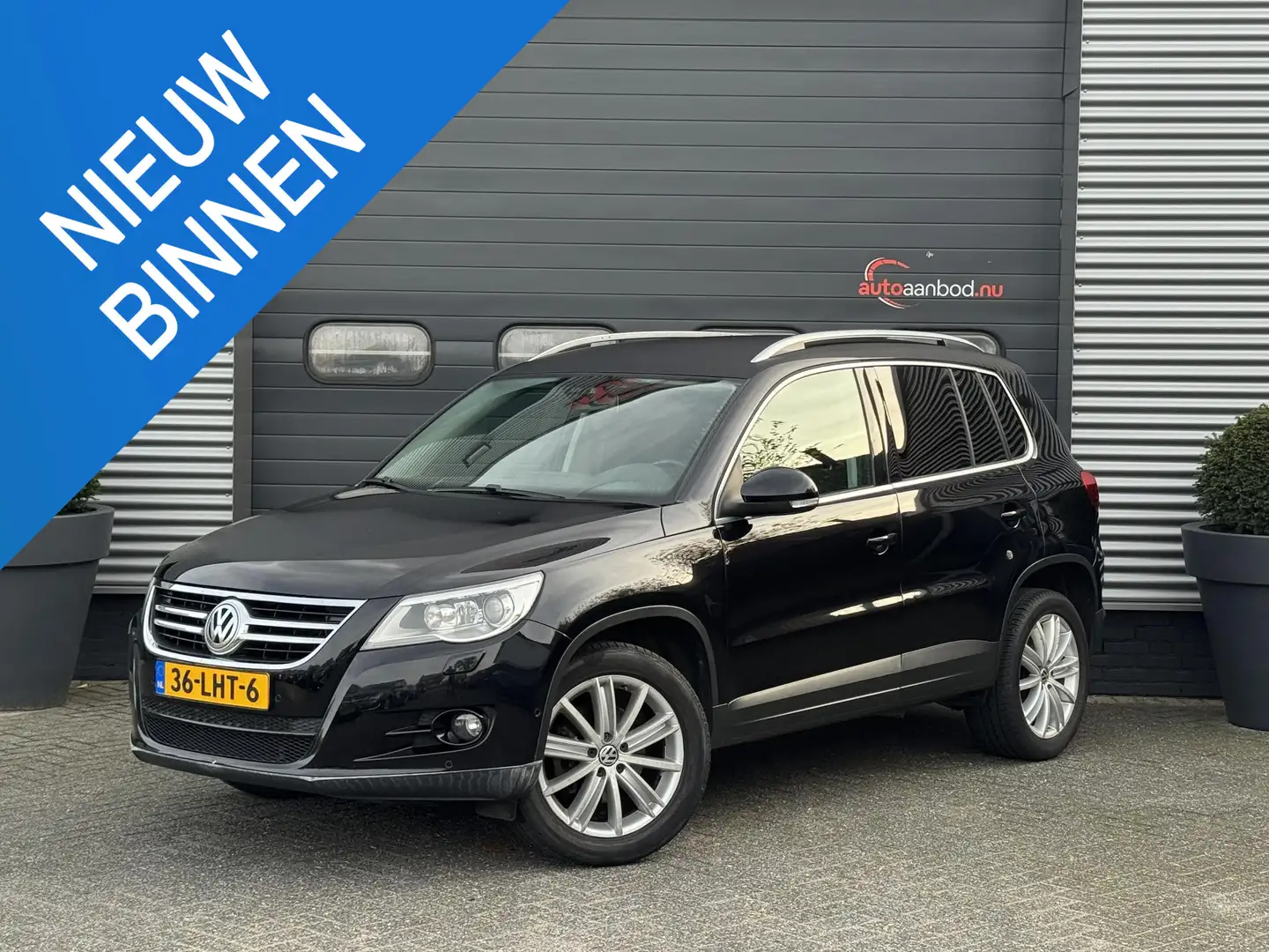 Volkswagen Tiguan 1.4 TSI Sport&Style | Navigatie | Camera | Xenon | Zwart - 1