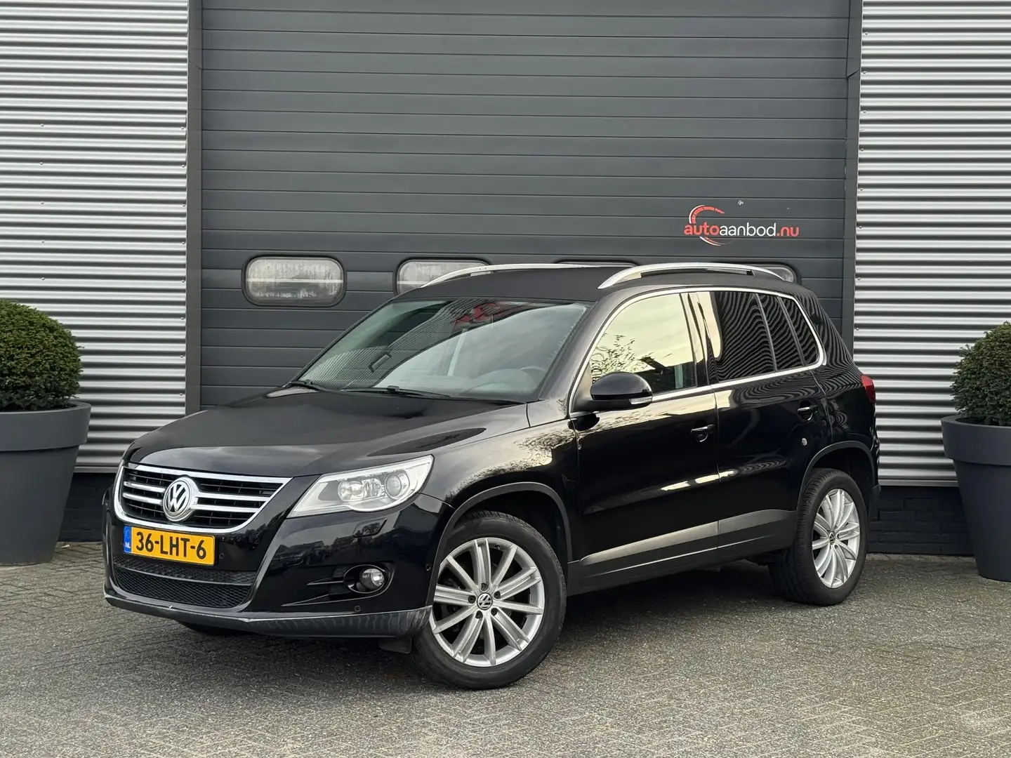 Volkswagen Tiguan 1.4 TSI Sport&Style | Navigatie | Camera | Xenon | Noir - 1