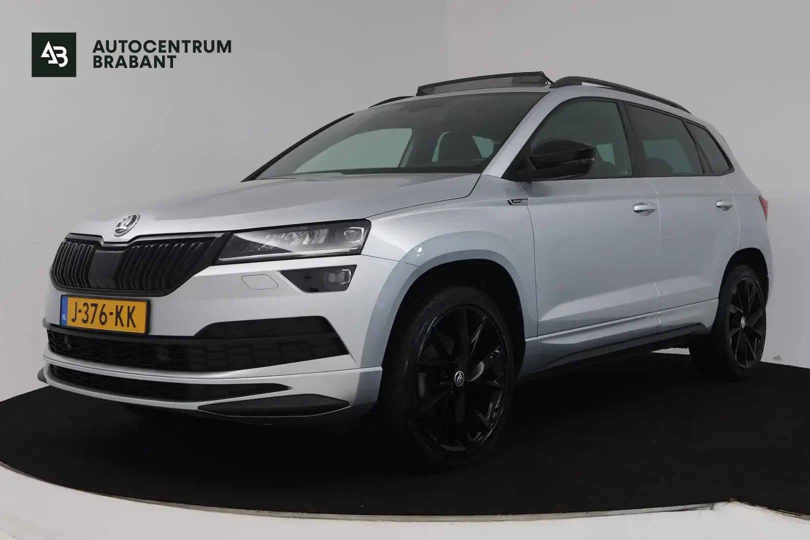 Skoda Karoq 1.5 TSI ACT Sportline Business (PANORAMADAK, STOEL Gris - 1
