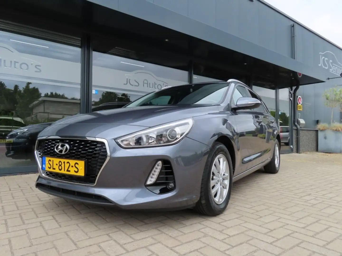 Hyundai i30 1.4 T-GDI Aut. Ecc Cruise Navi Trekhaak Pdc 2018 Grigio - 1