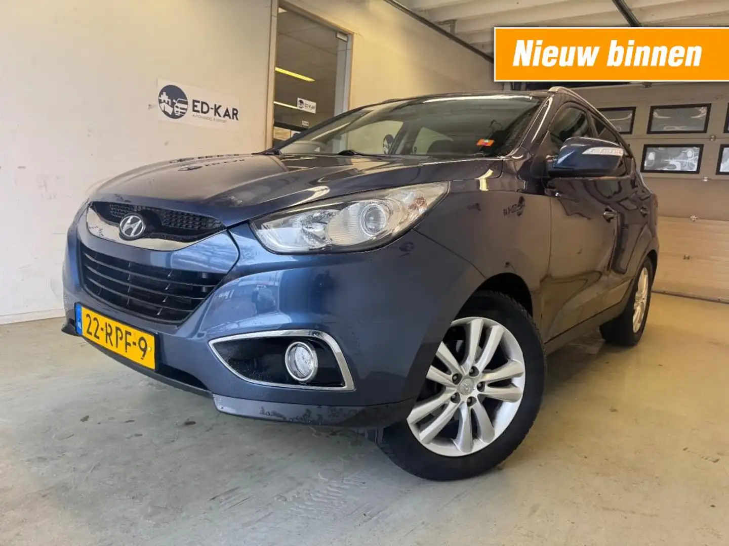 Hyundai iX35 2.0 CRDi HP 4WD i-Catcher PANO NAVI LEER NAP APK Blauw - 1