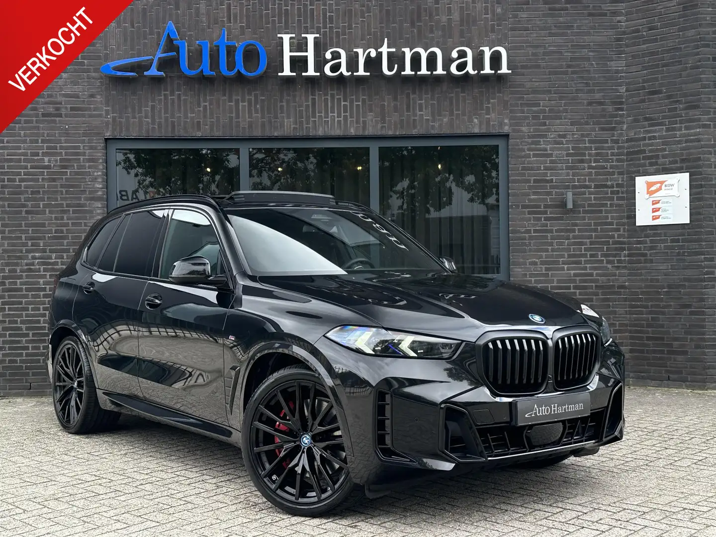BMW X5 xDrive50e M Sport Pro PANO|H&K|ICONICGLOW|ACHTERAS Schwarz - 1