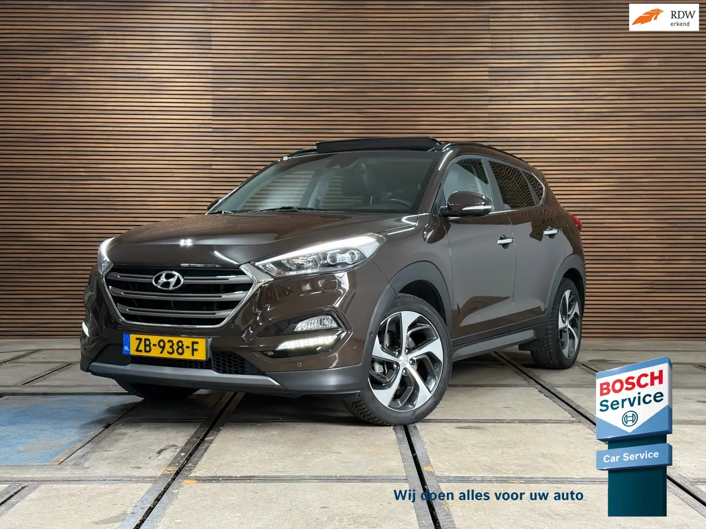 Hyundai TUCSON 1.6 T-GDi Premium 4WD Automaat | Pano | Winterpakk Bruin - 1