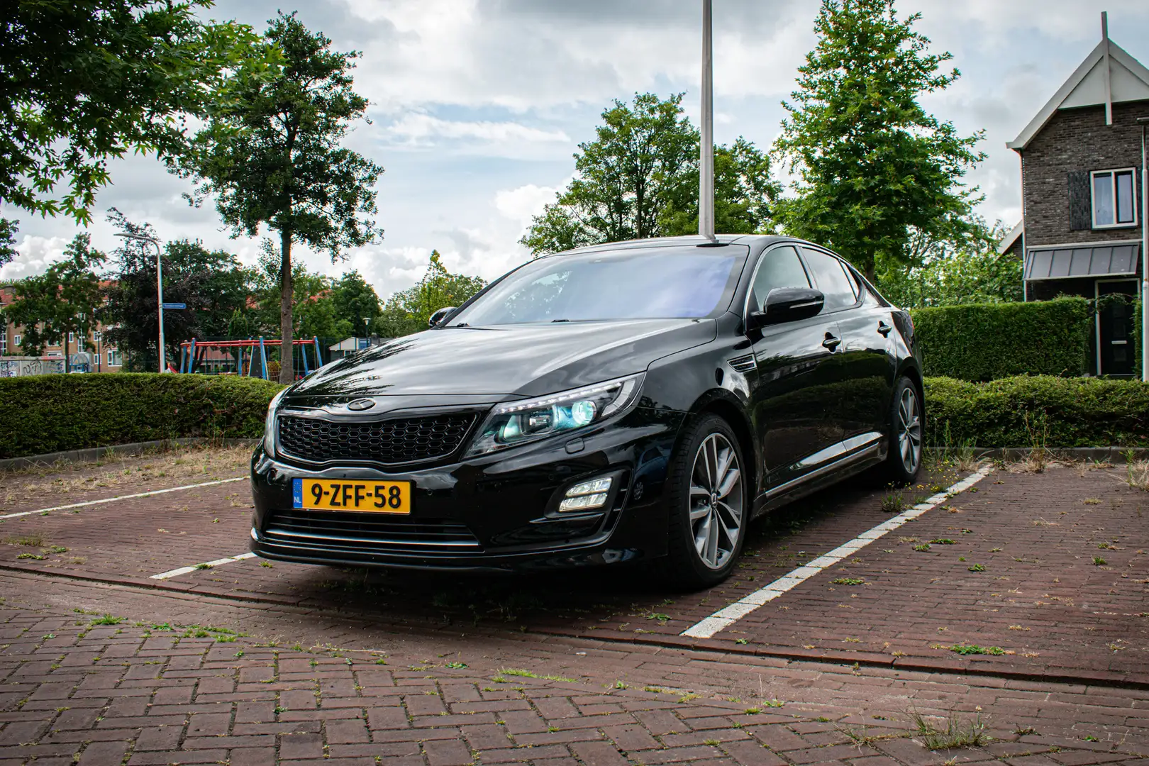 Kia Optima 2.0 CVVT Hybrid Ex.L Zwart - 1