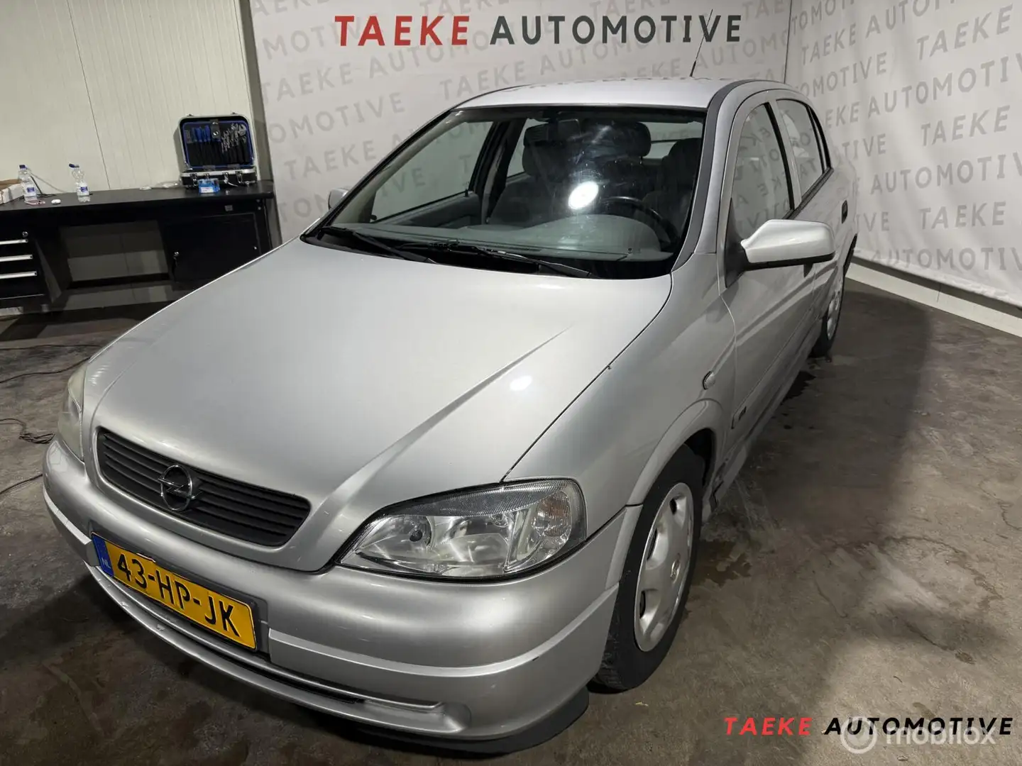 Opel Astra 1.6-16V Comfort Automaat/Airco/Apk/2e EIG Grijs - 1