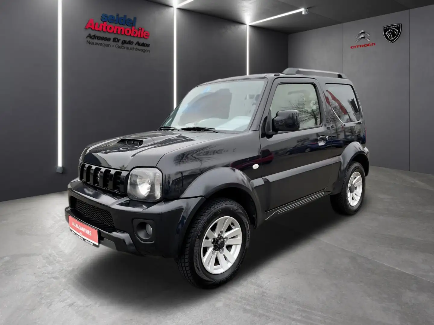 Suzuki Jimny 1.3 4WD Ranger Style 1.Hand, wenig KM Black - 1