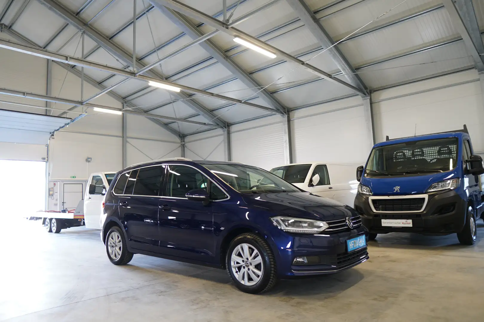 Volkswagen Touran 1,5 TSI Highline 7Sitze DSG PANO FULL LED RFK NAVI Blauw - 1