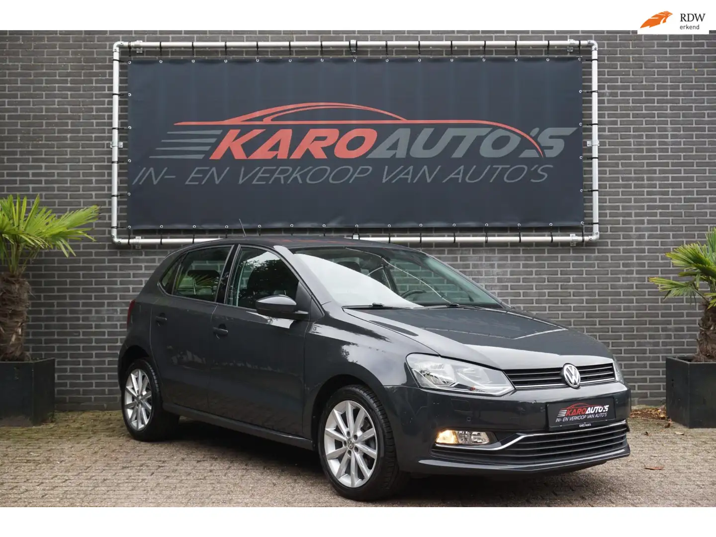 Volkswagen Polo 1.2 TSI Highl Cruise Clima Elek R Stoelv Pdc Gris - 1