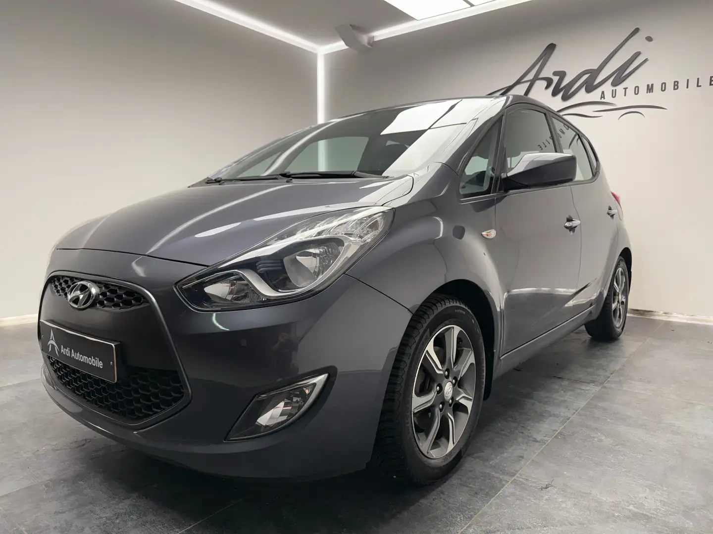 Hyundai iX20 1.6i*CAMERA*GPS*SIEGES + VOL CHAUFF*GARANTIE* Grijs - 1