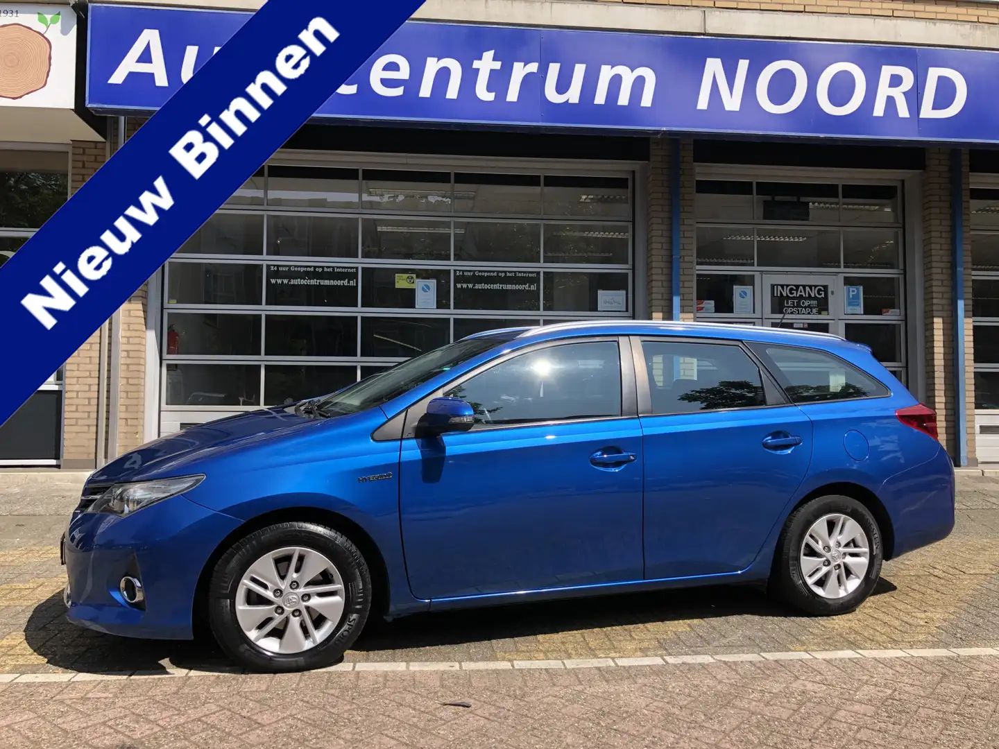 Toyota Auris Touring Sports 1.8 Hybrid Aspiration NAP BTW auto Blauw - 1