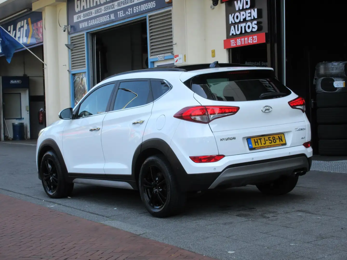 Hyundai TUCSON 1.6 T-GDi Comfort 4WD Aut Leer Navi Camera Carplay Wit - 2
