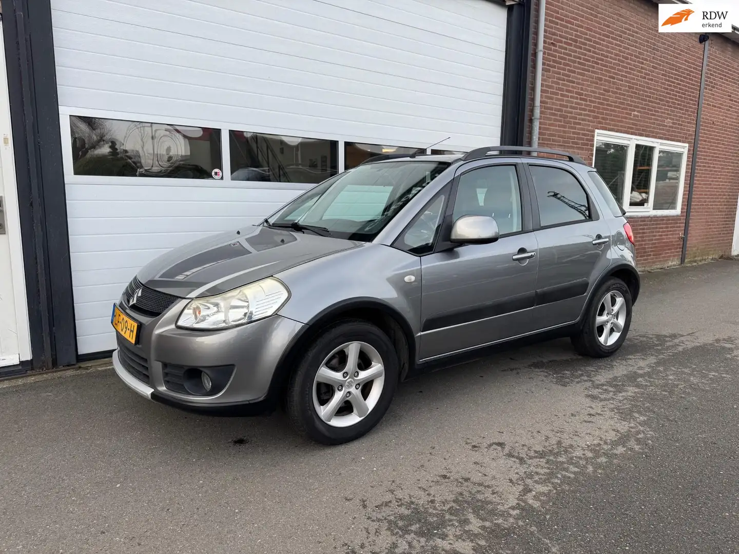 Suzuki SX4 1.6 Comfort I Airco I Trekhaak I Stoelverwarming I Grau - 1