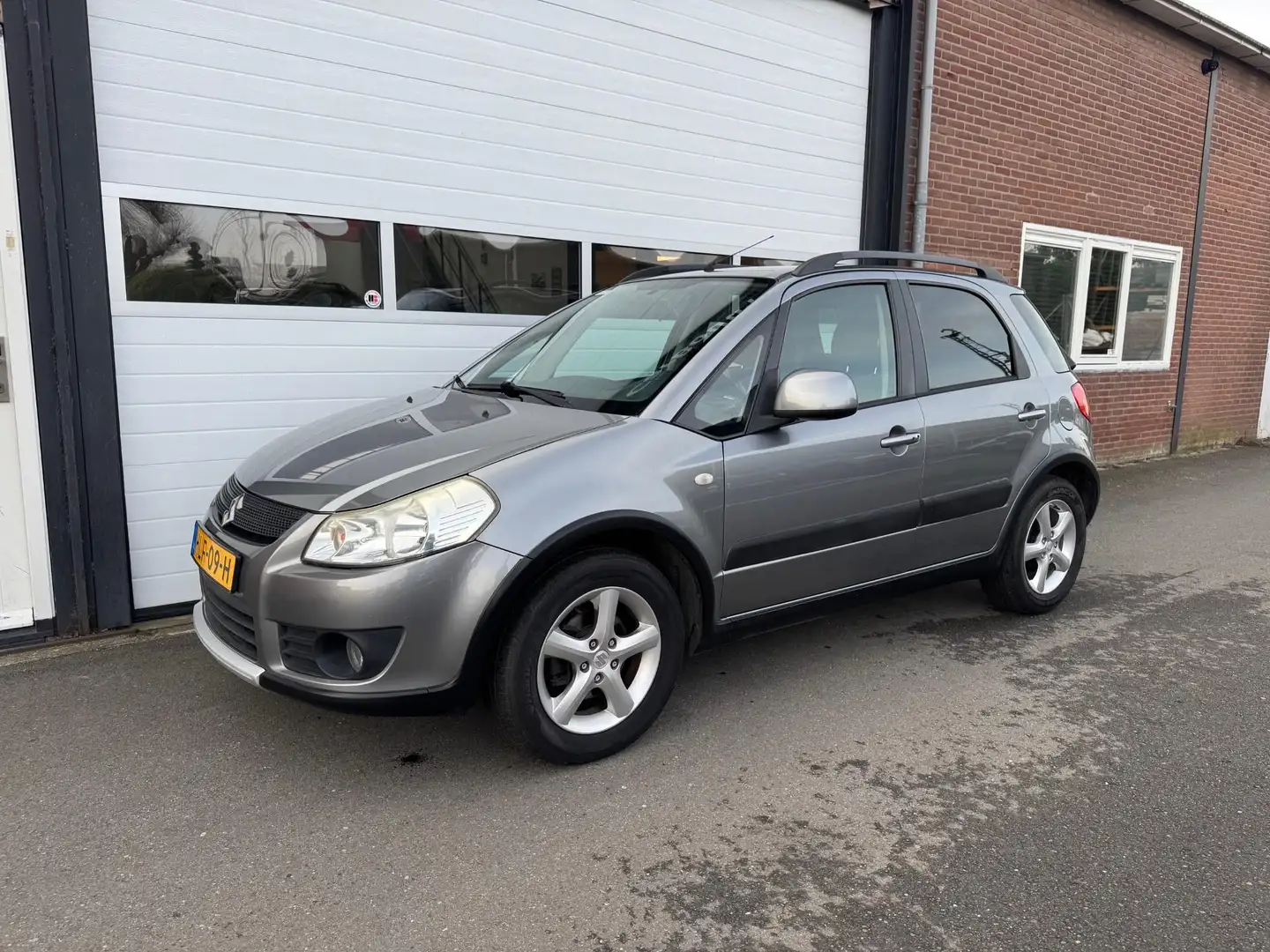 Suzuki SX4 1.6 Comfort I Airco I Trekhaak I Stoelverwarming I Grau - 1