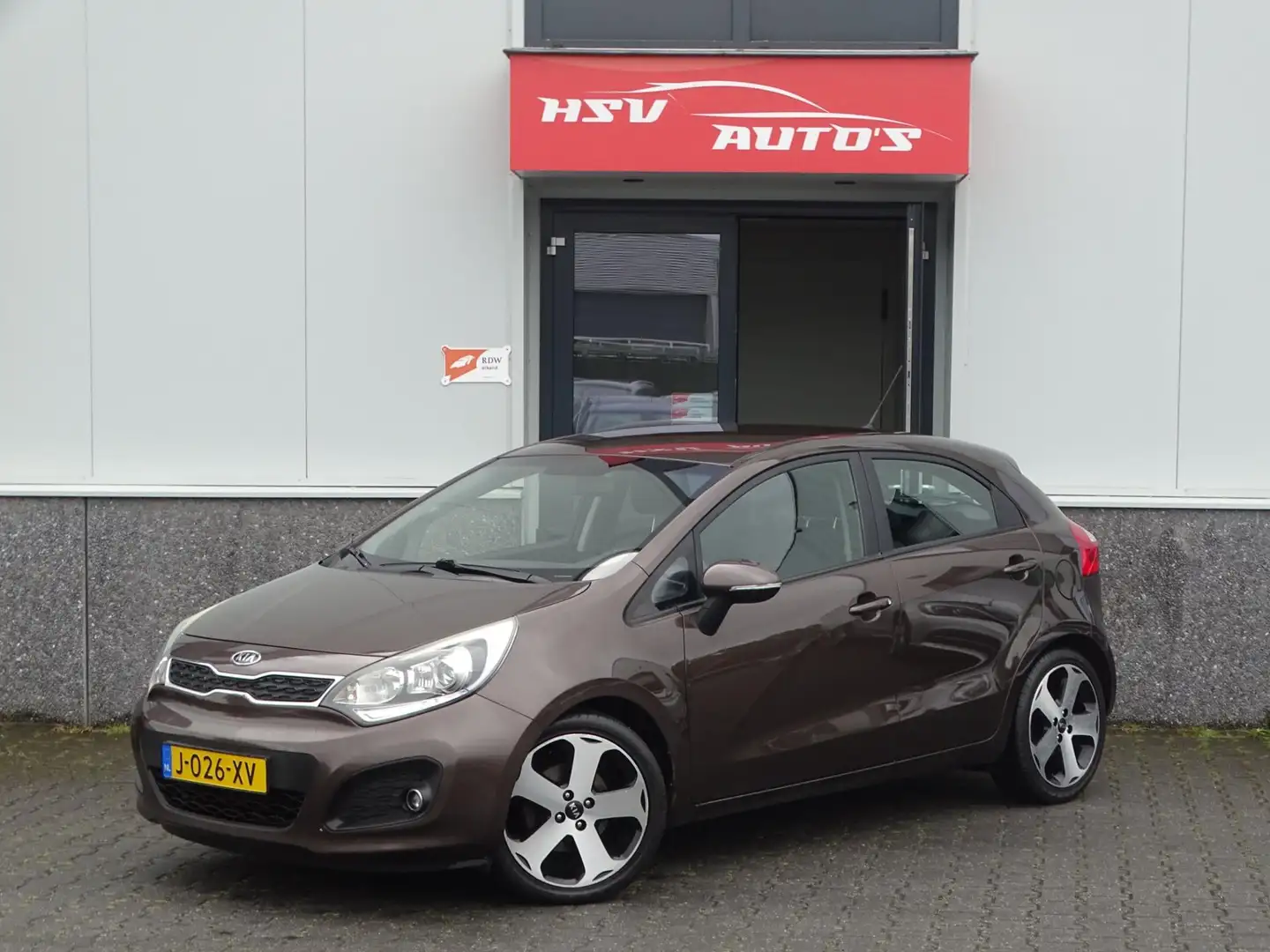 Kia Rio 1.2 CVVT airco LM cruise Bruin - 1