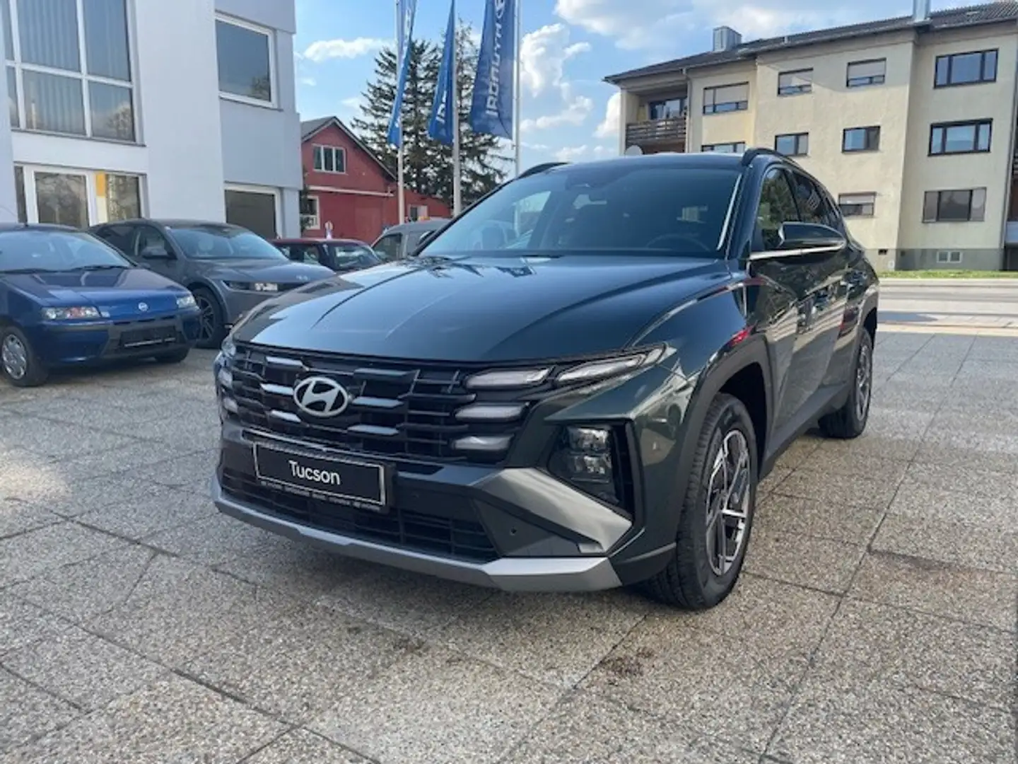 Hyundai TUCSON Tucson 1,6 T-GDI HEV 2WD Jubilé Aut. Grün - 1