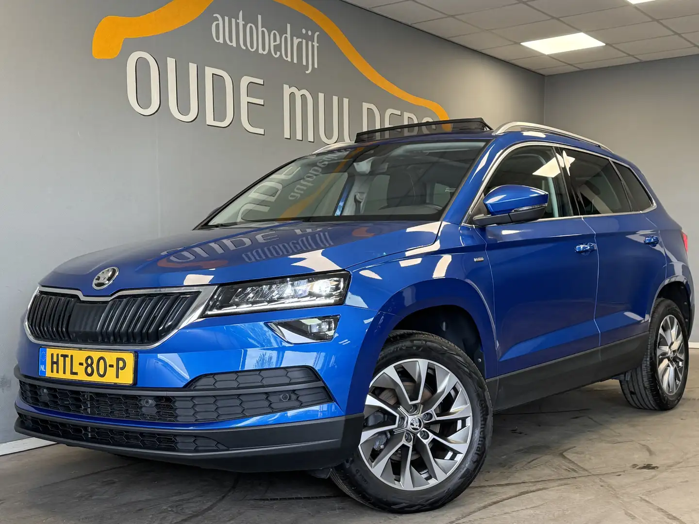 Skoda Karoq 1.5 TSI ACT Stoelverwarming/Panoramadak/Trekhaak Blauw - 1