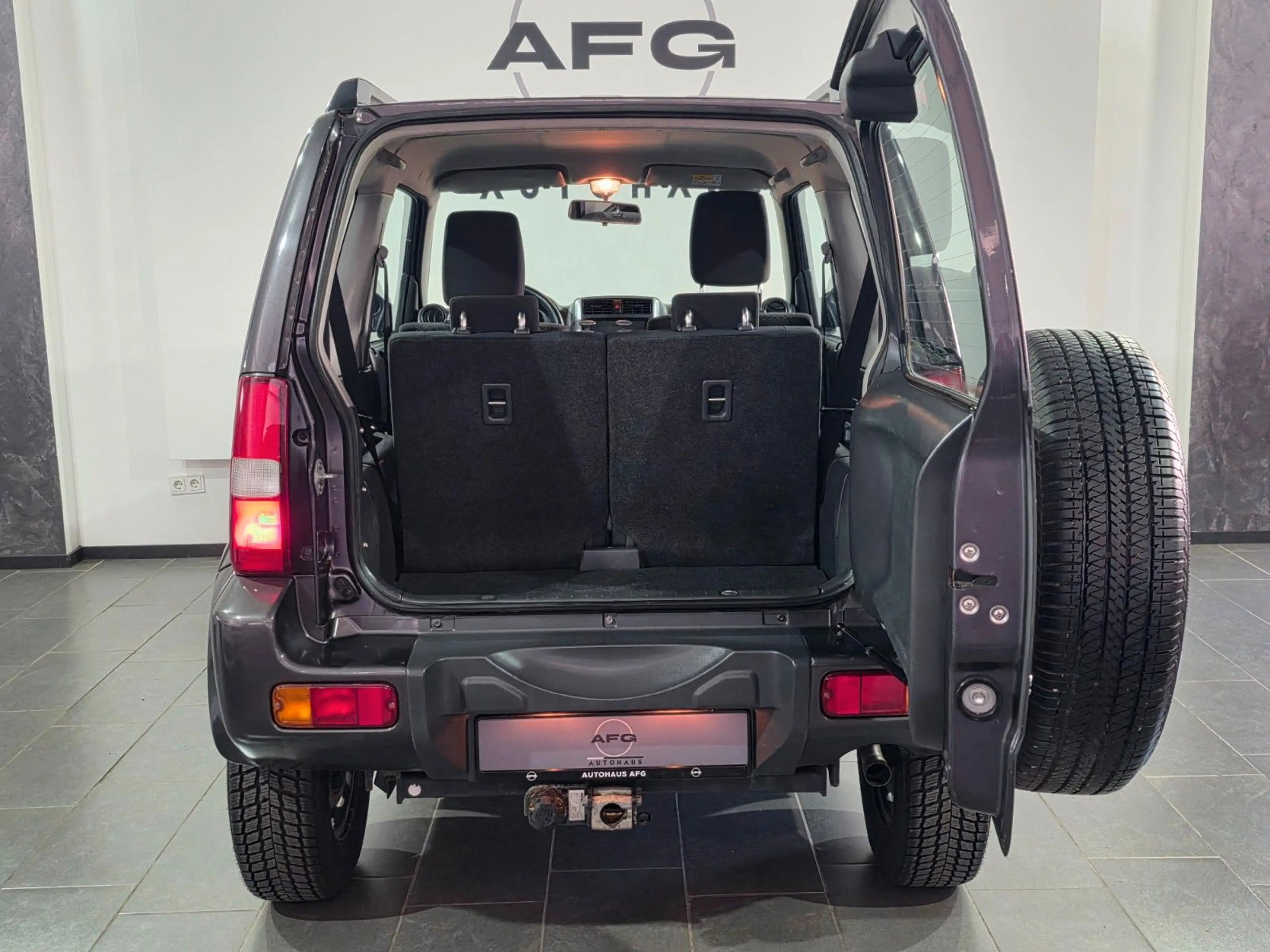Suzuki Jimny Comfort Lim.*4X4*AHK*SHZ* — photo 11