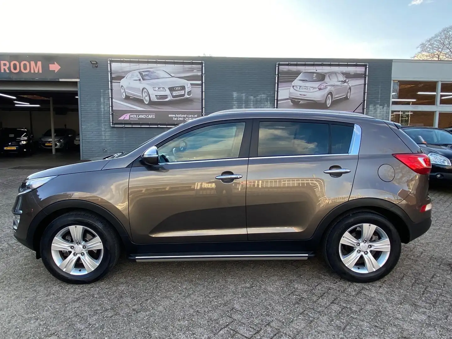 Kia Sportage 2.0 X-ecutive Plus Pack Automaat 1e Eigenaar 84.13 Bruin - 1