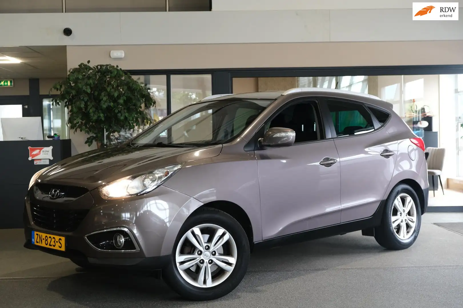 Hyundai iX35 1.6i GDI Business Edition Navi Cruise Cam Trekhaak Bruin - 1