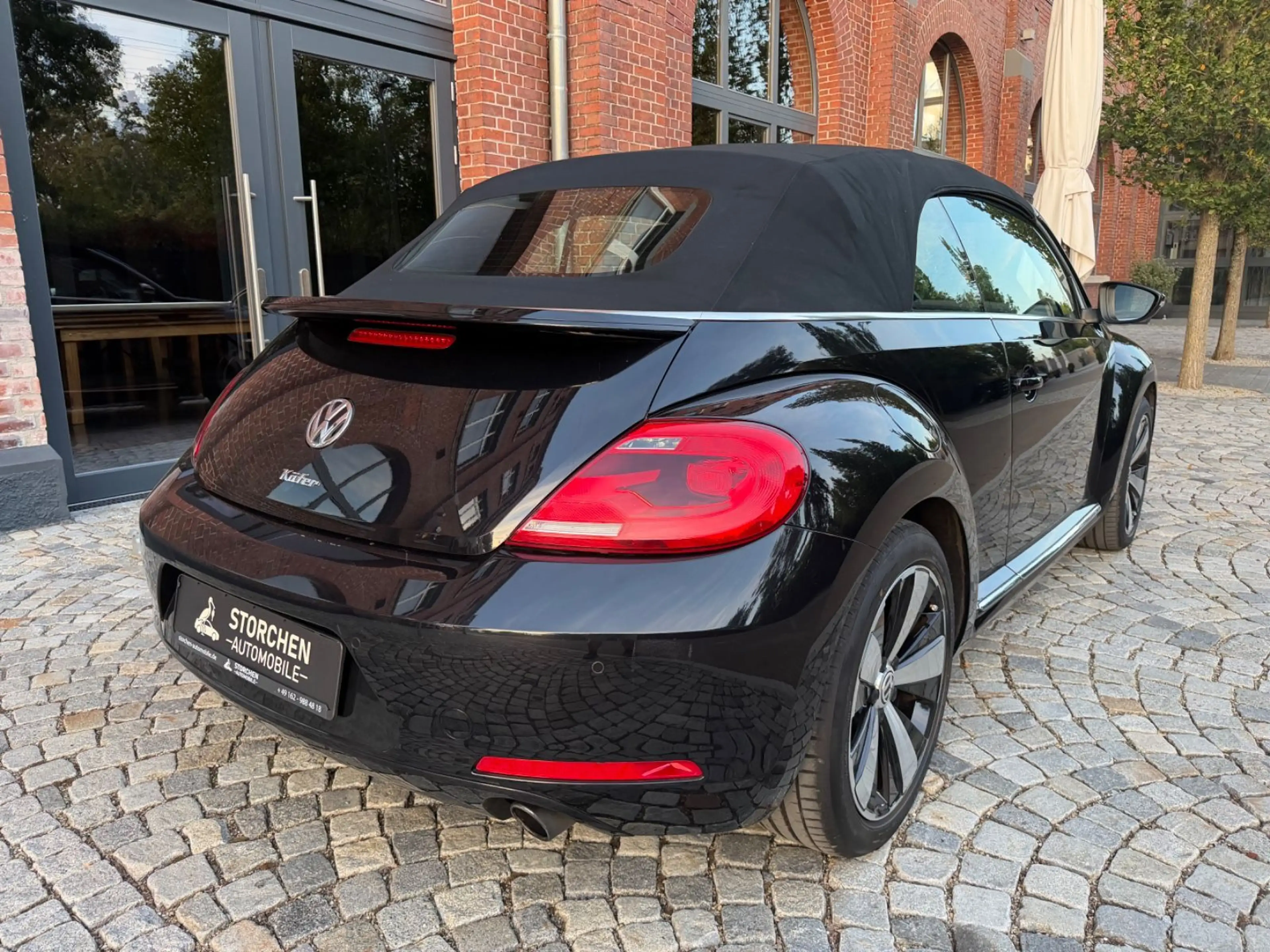 Volkswagen Beetle Cabrio Exclusive Sport *1.Hand*Navi*Leder — photo 4