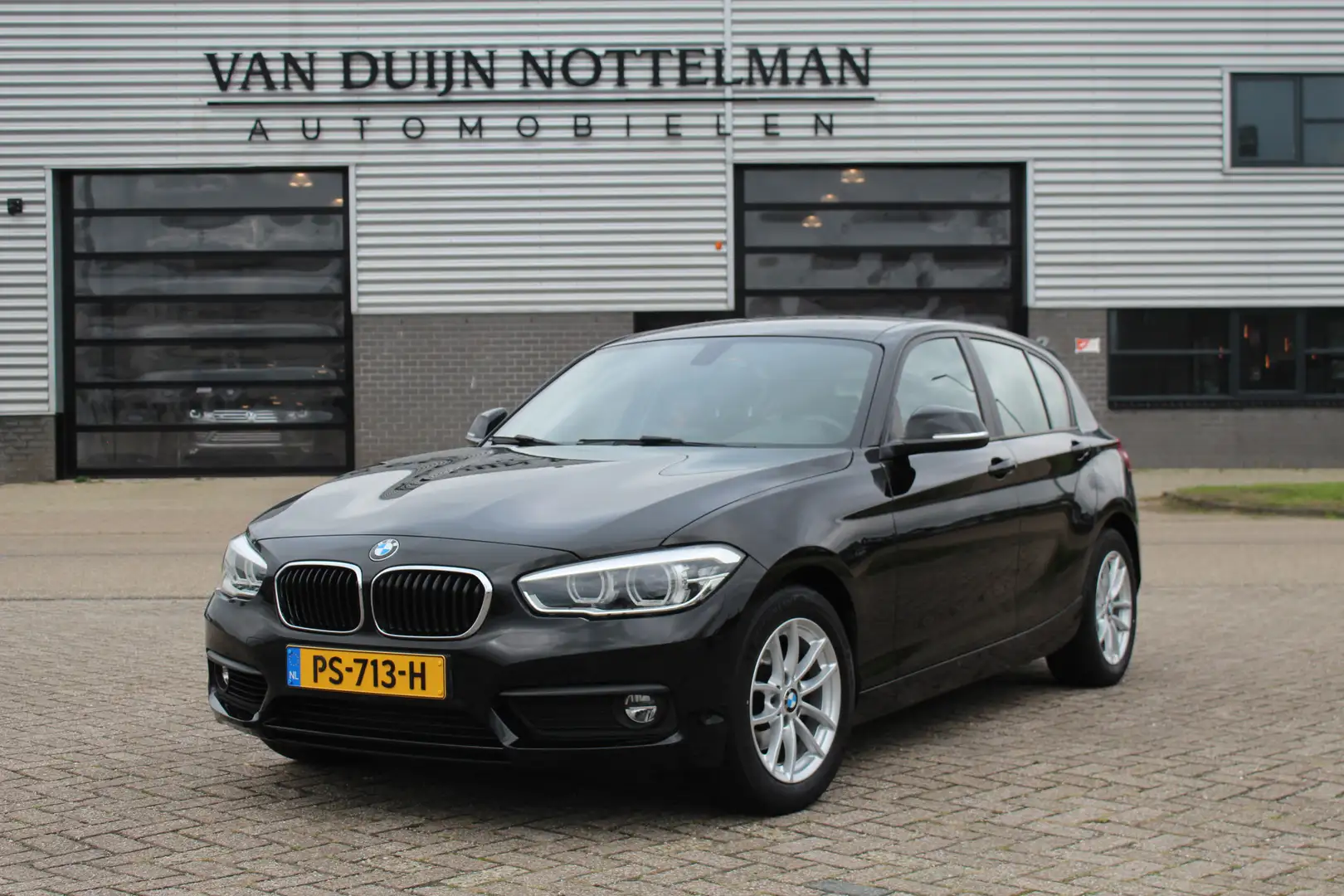 BMW 118 1-serie 118i Executive / Led / Automaat / N.A.P. Zwart - 1