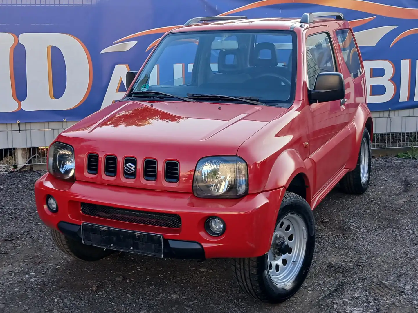 Suzuki Jimny 1,3 Club 4WD *4x4*1.HAND*SCHECKHEFT*HU/TÜV NEU* Rot - 1