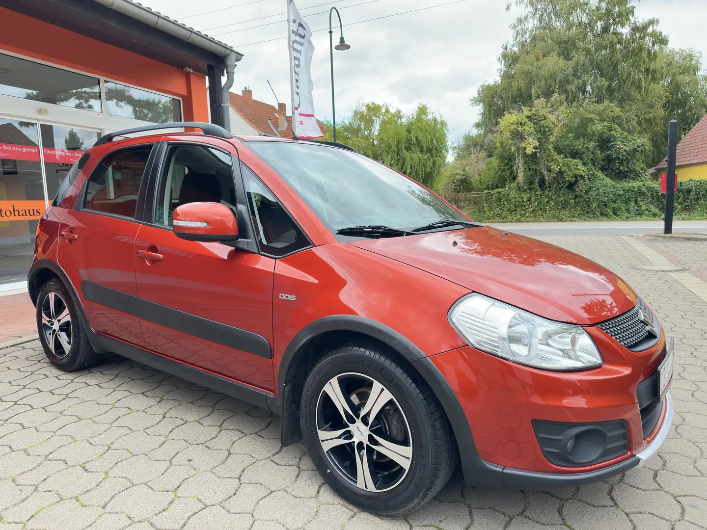 Suzuki SX4 Club * Klima * AHK * SHZ * Navi * 1.Hand * Orange - 1
