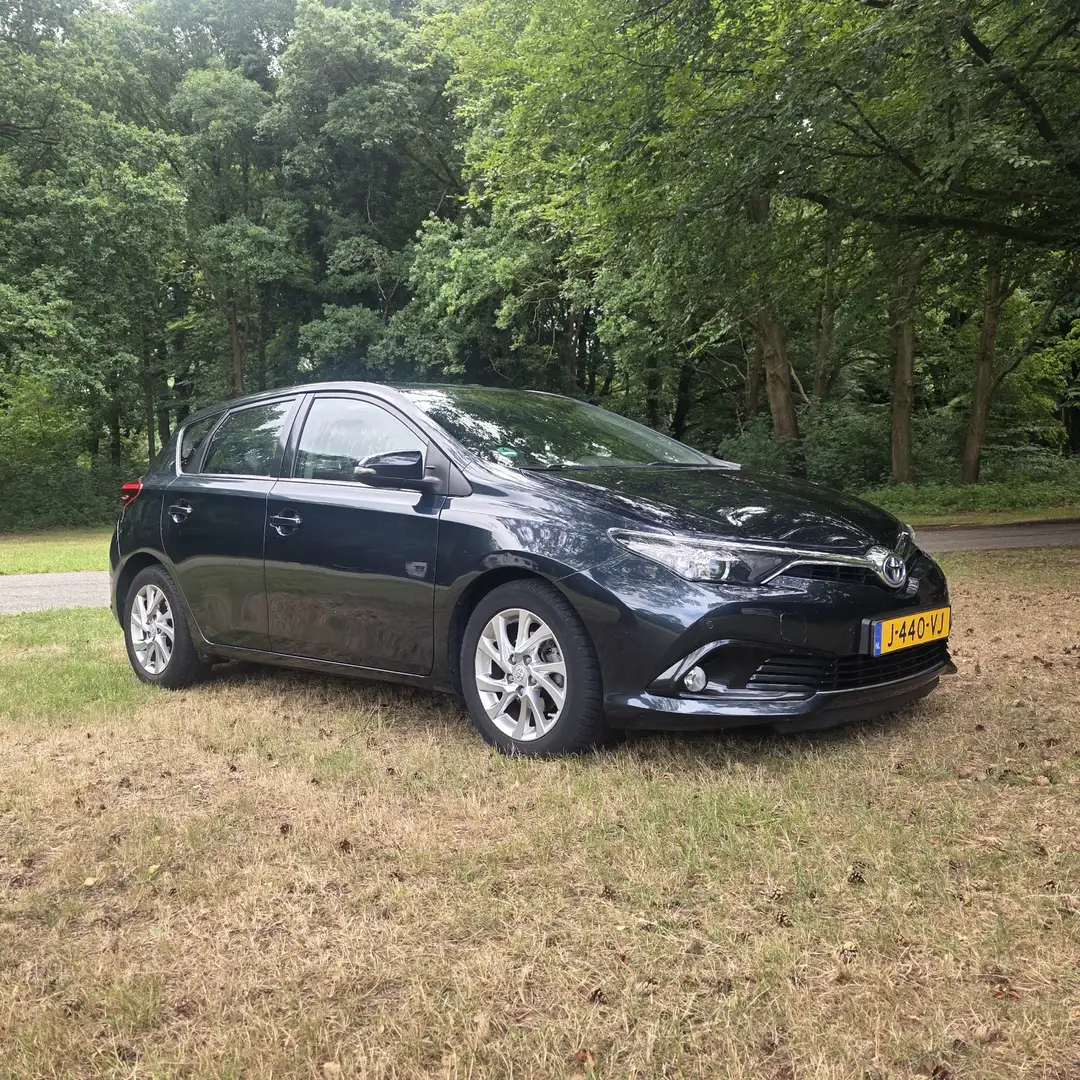 Toyota Auris 1.8 Hybride Aspiration Blauw - 1