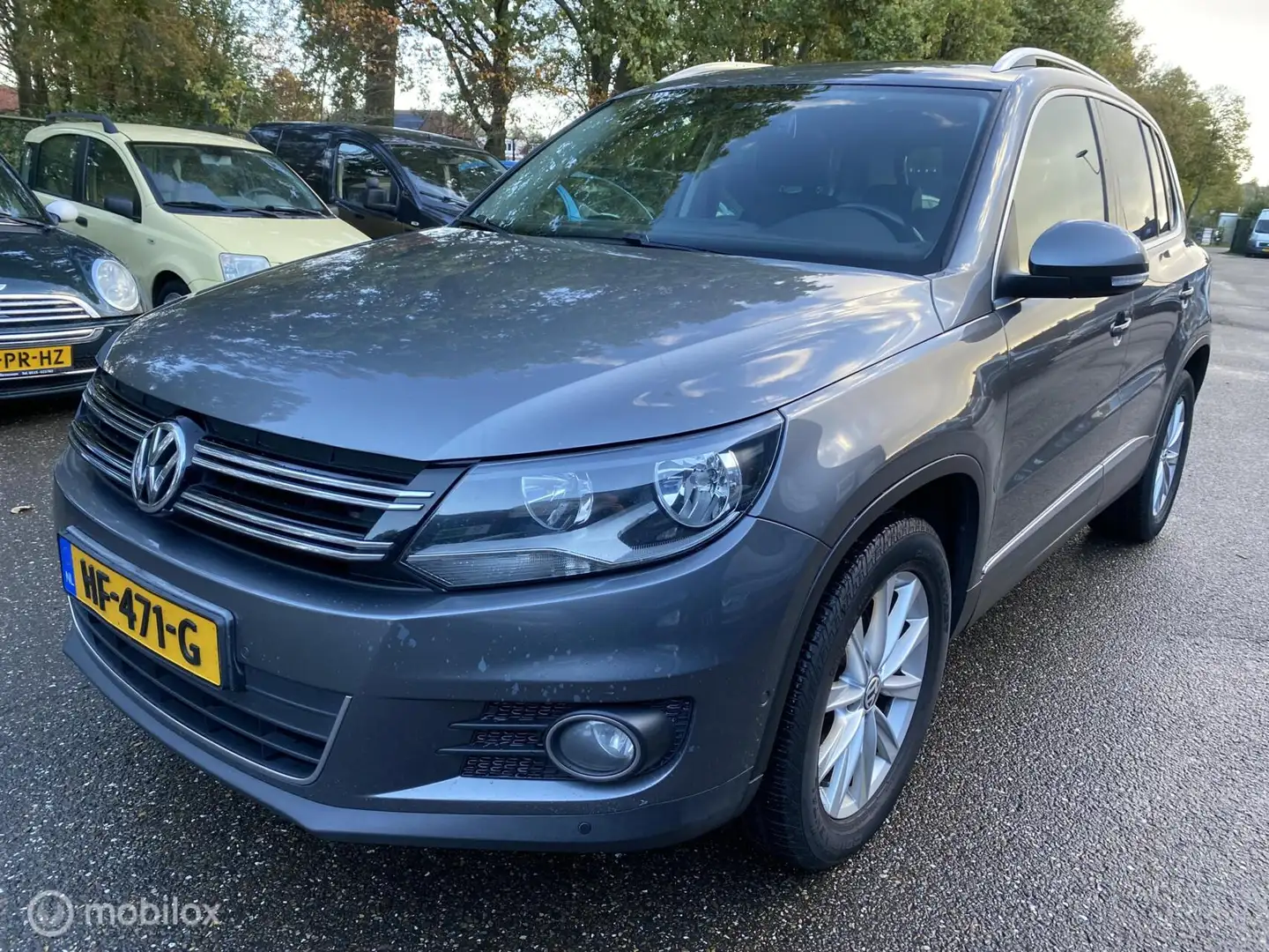 Volkswagen Tiguan 2.0 TDI Sport&Style ECC LEDER PANO CRUISE NAVI PDC Grijs - 1