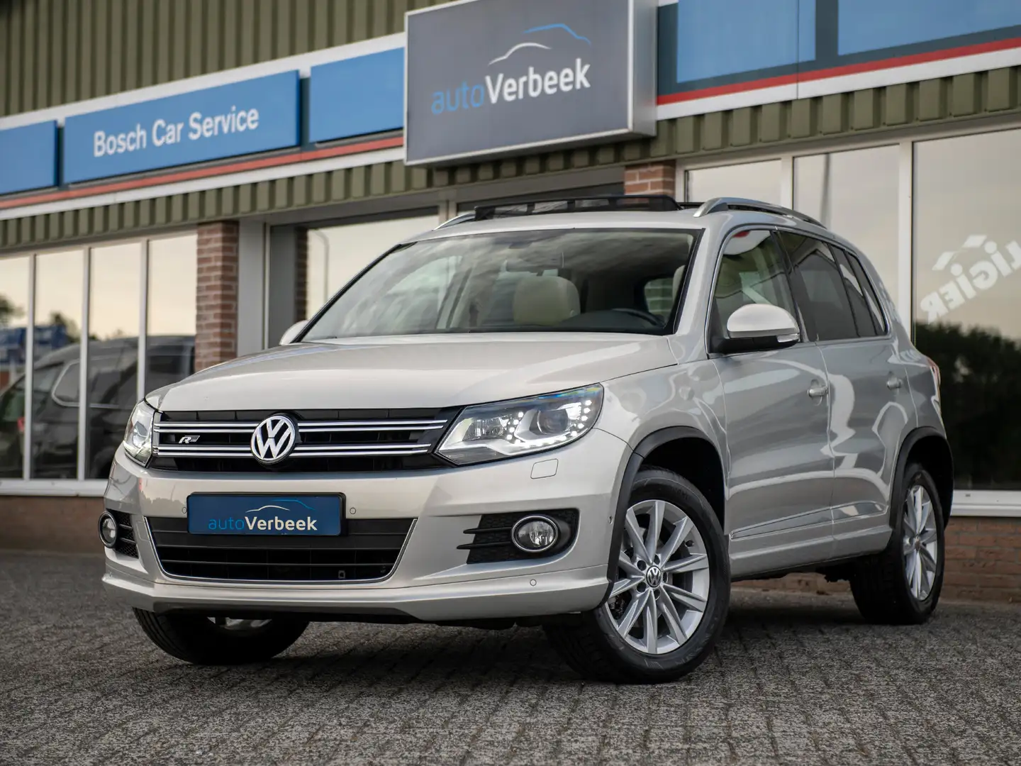 Volkswagen Tiguan 2.0TSi 180pk DSG R-Line Sport&Style 4Motion | Pano Grigio - 1