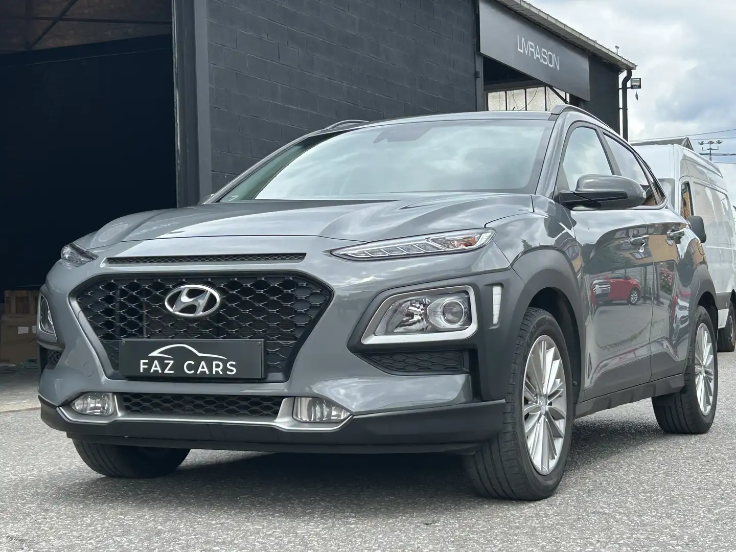 Hyundai KONA 1.0 T-GDi * 1ER PROP + CLIM + GPS + CAMERA * Grijs - 1