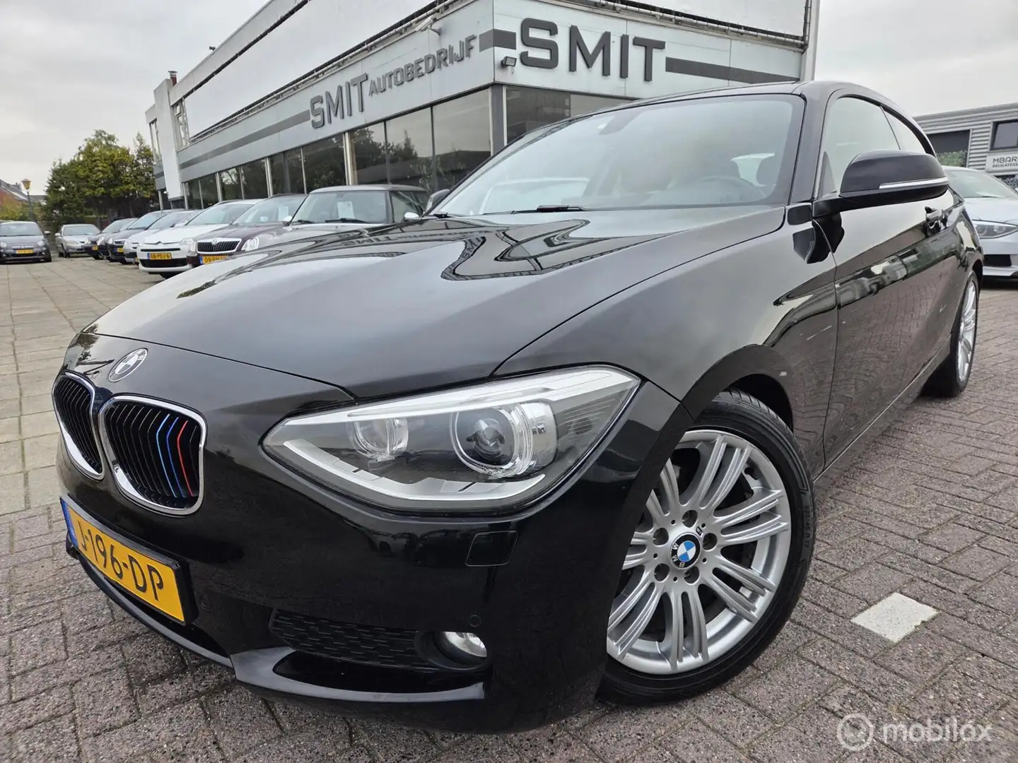 BMW 116 1-serie 116i EDE Business+ Led/Xenon/Ecc/CC/PDC/De Zwart - 1