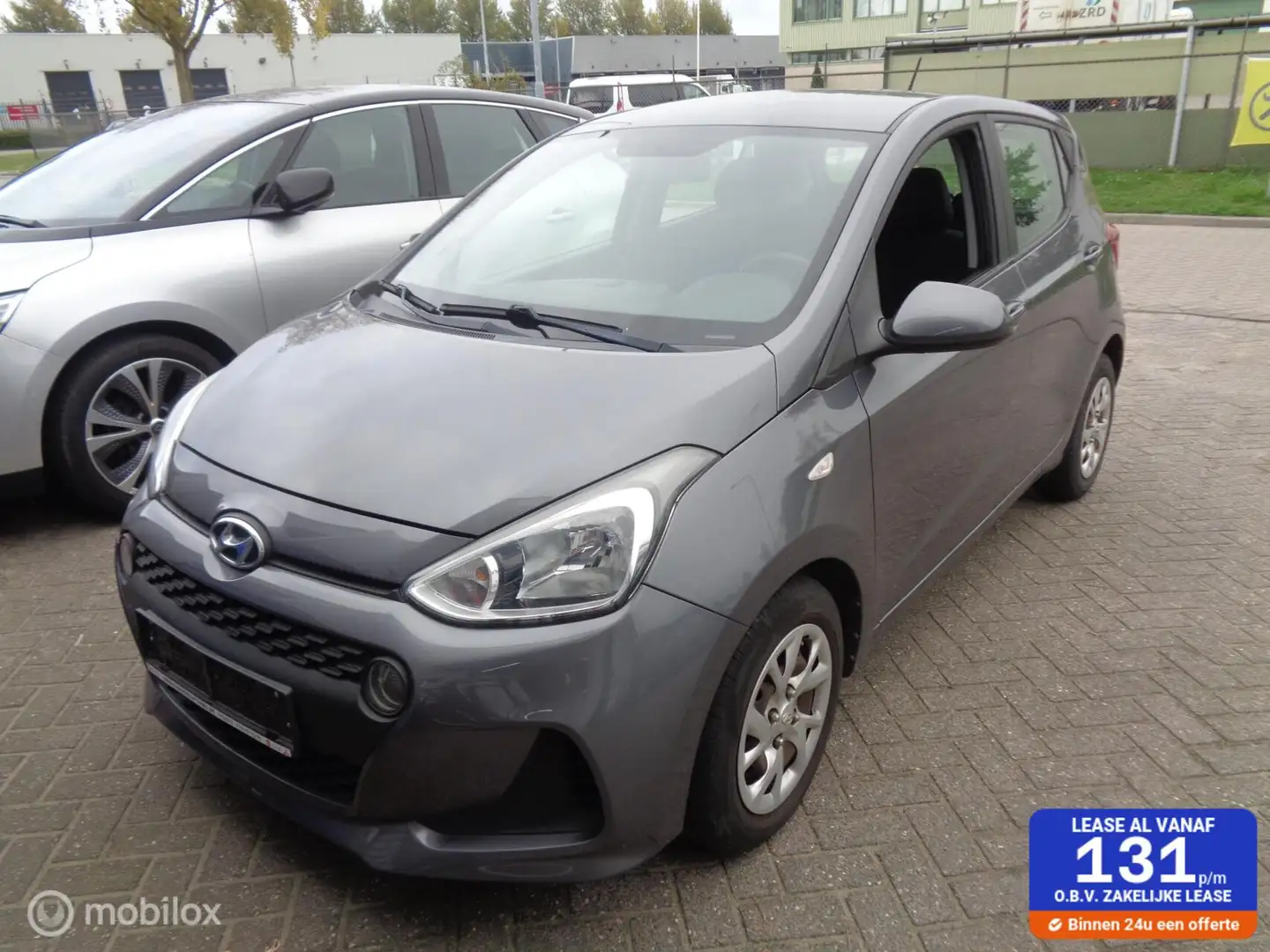 Hyundai i10 1.0i Comfort 5 deurs/Airco/Bluetooth/Stuurbekr/Cru Grijs - 1