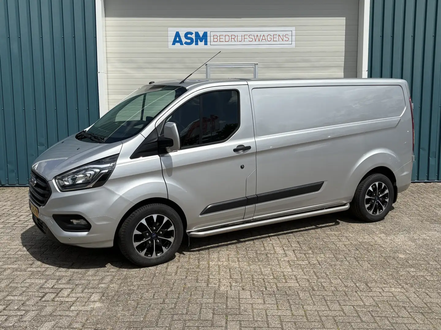 Ford Transit Custom 300 2.0 131Pk TDCI L2H1 Trend / Cruise / Airco / N Grijs - 1